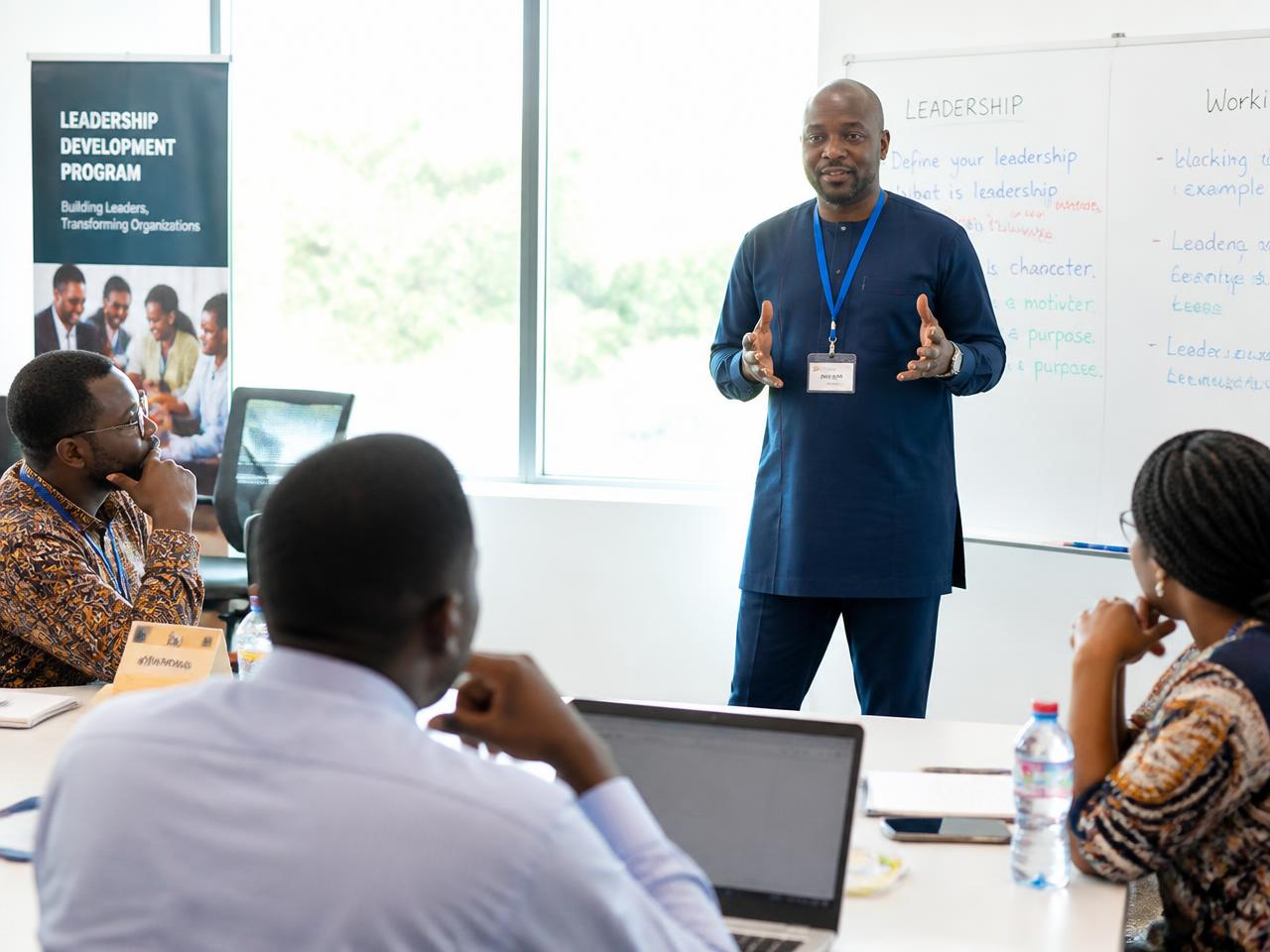 Professionals participating in a corporate training workshop with a facilitator